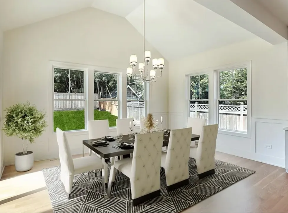 Dining room — vaulted ceiling, wainscoting, new windows and oak flooring