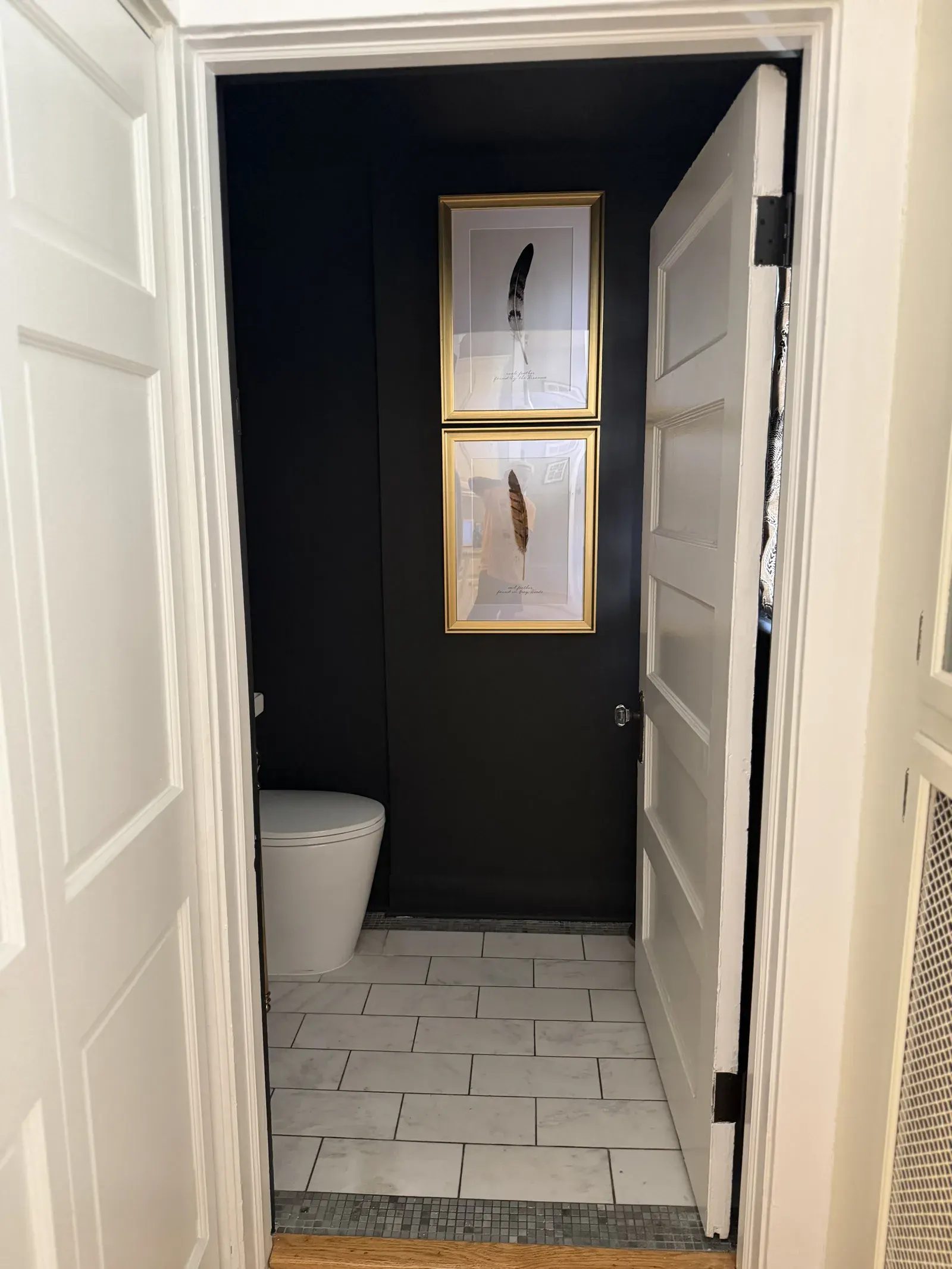 Powder room entry — herringbone-set floor tile