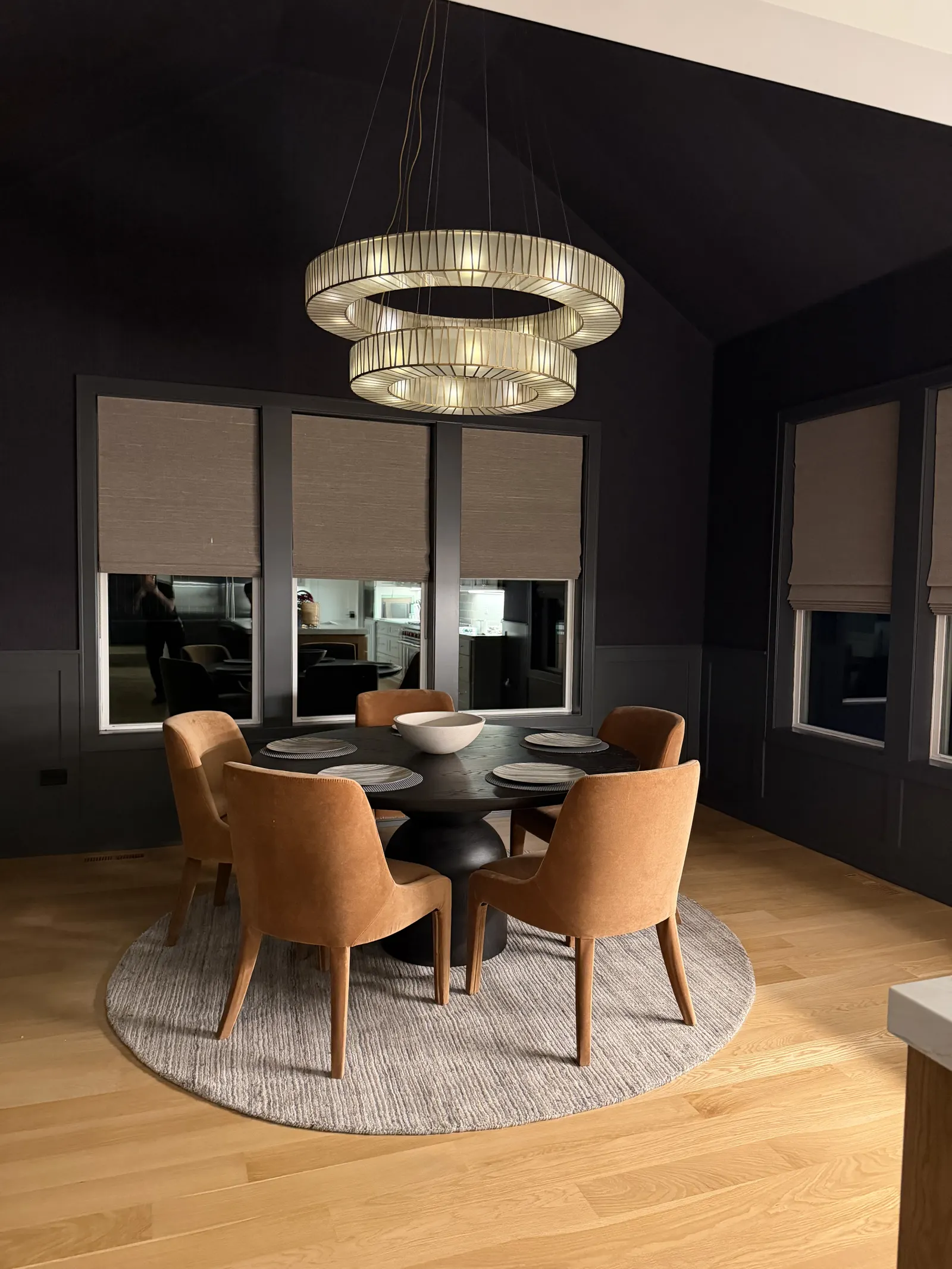 Dining nook — statement chandelier and refinished floors